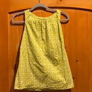 Lime and white sleeveless top.